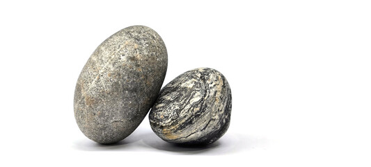 Separated sea pebbles on white background © Pisan