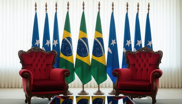 Brazilian and state flags flank ornate red chairs in a formal setting.