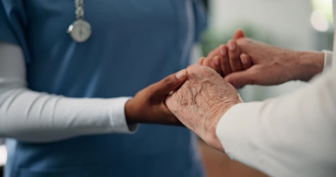 Caregiver, holding hands and comfort senior person for reassurance, medical news and empathy. People, consoling or support for healthcare, understanding and rehabilitation of elderly patient at house