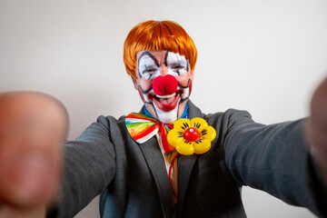 Clown smiling taking selfie with funny expression