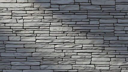 Obraz premium Close-up of a gray stone wall with a white background and a shallow depth of field, showcasing stacked slate tiles.