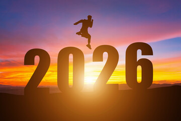 Happy New Year Numbers 2026, Silhouette a man handsome jumping feels happy moving early morning sunrise over the horizon background, Health and Happy new year concept.