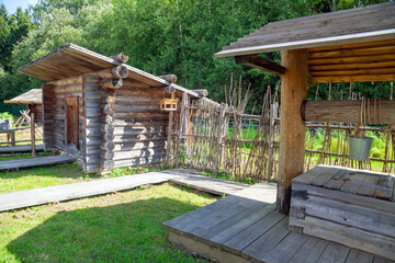 Rural Well with Wooden Roof and Bucket
