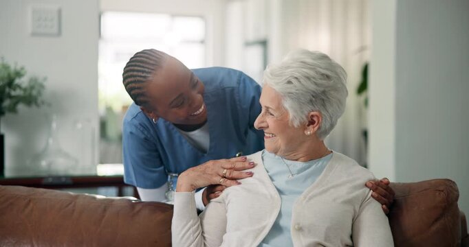 Caregiver, laughing and hug with old woman, homecare and bonding in lounge, senior care and talking. People, discussion and nurse with pensioner, embrace and happy for health or retirement in house