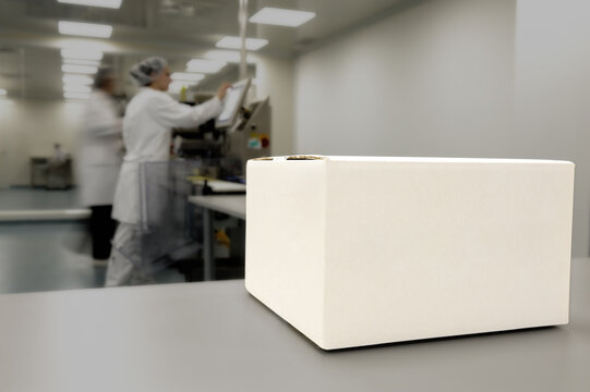 Crate in front of medical staff in modern factory