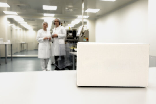 Crate in front of medical staff in modern factory