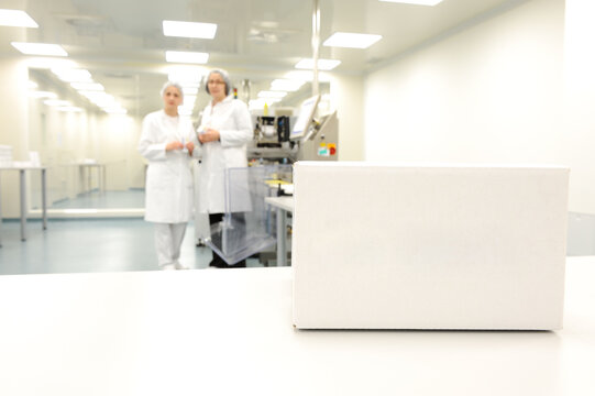 Crate in front of medical staff in modern factory