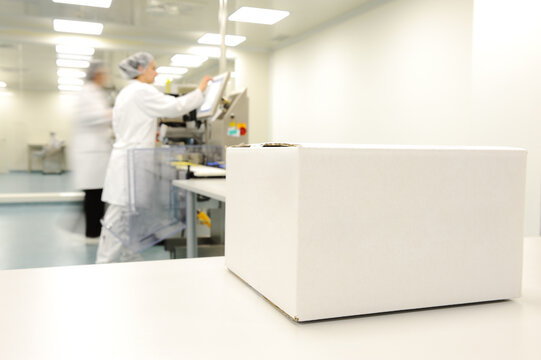 Crate in front of medical staff in modern factory