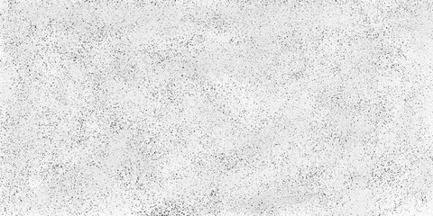 Subtle speckled texture background with fine black dots on a light grey textured surface pattern