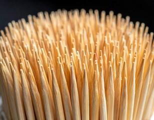 Close-up of numerous wooden toothpicks arranged tightly