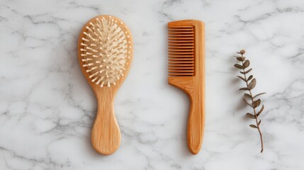 Flat lay of wooden hair brush and comb on white marble table, showcasing natural hair care tools and minimalist styling essentials