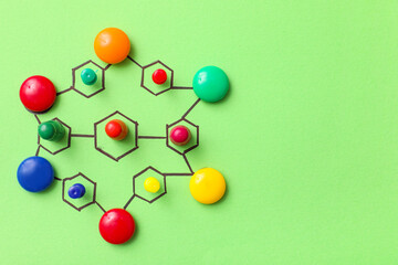 Connected figures on green background. Link concept