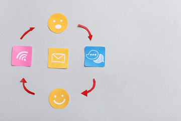 Connected smiles with communication symbols on light background. Link concept