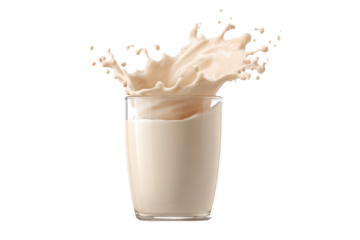 Splash of milk spills from a glass on a white background during a dynamic moment in a kitchen setting