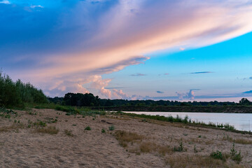 Sunset on the cloudy river.