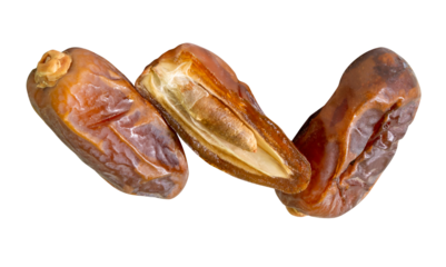 Ripe dried date palm fruits witth half in stack isolated with clipping path in png format Concept of iftar food in Ramadan month for Muslims