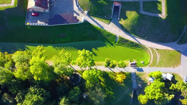 Nesvizh Castle - a top view of a medieval castle in autumn, Belarus. A landscape with a palace surrounded by a moat on a sunny autumn day. The Radziwill Family Castle from a bird's-eye view. 4К