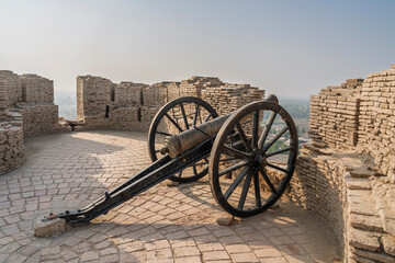 Landscape view of vintage cannon on top of bastion at historic Kot Diji fort, Khairpur, Sindh, Pakistan