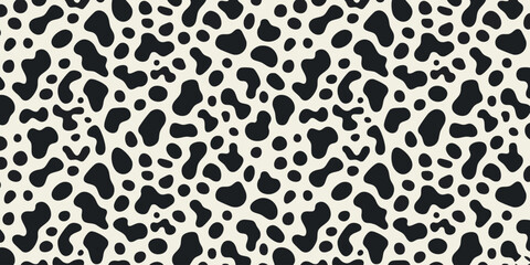 Black and white dalmatian dog or animal skin irregular spots pattern.