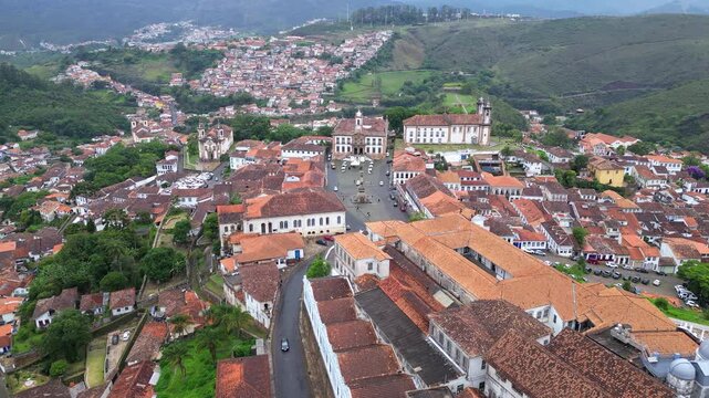 Ouro Preto, Brazil: Forward aerial drone footage of Tiradente museum situated in Ouro Preto townsquare, old town of Brazil with  Bas&iacute;lica Nossa Senhora do Pilar in the center in Minas Gerais