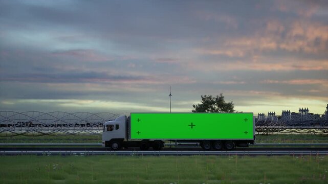 White Semi Truck Driving on Highway at Sunset with Green Screen Trailer for Advertisement Mockup