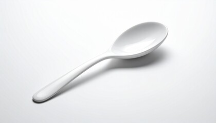 &ldquo;White ceramic Asian-style soup spoon on smooth light surface&rdquo;