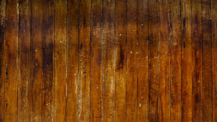 Dark brown rustic wood plank wall texture background, vintage vertical wooden board surface.