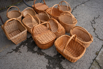 Woven baskets on the floor, many for sale on street market.
