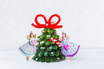 Love angel with Christmas tree on white background, decoration items, Christmas card background idea