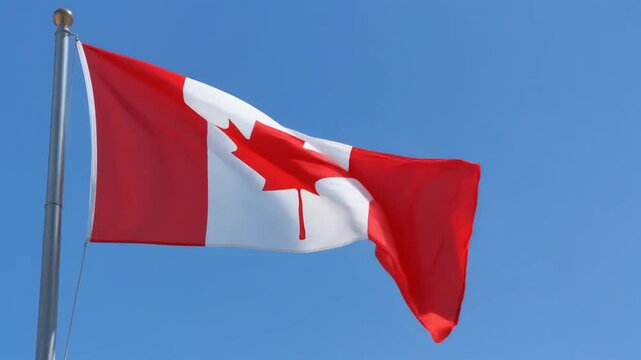 Canadian national flag waving against blue sky symbolizing unity identity and cultural heritage