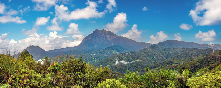 Panoramic view of the iconic Mount Kinabalu from the forests of the Kinabalu Park, Sabah, Borneo, Malaysia