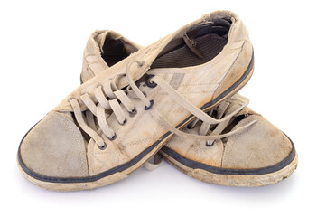 Old worn out sneakers isolated on white