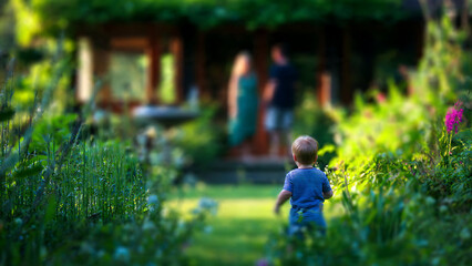 Tiny footsteps on a sun-dappled garden path, a child's gentle exploration towards distant family