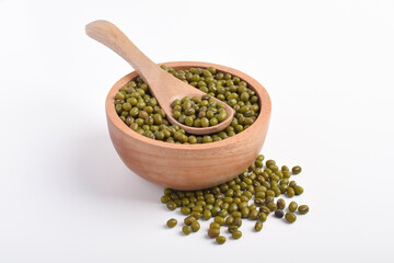 Mung beans in wooden bowl with wooden spoon isolated on white background.