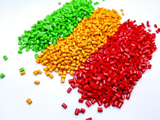 Colorful polymer plastic masterbatch pellets arranged by shade, showcasing high-quality additives used to enhance color, stability, and performance in plastic manufacturing processes efficiently