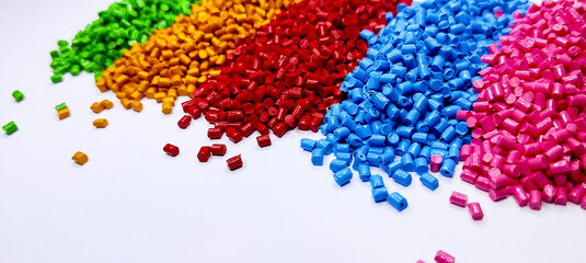 Colorful polymer plastic masterbatch pellets arranged by shade, showcasing high-quality additives used to enhance color, stability, and performance in plastic manufacturing processes efficiently