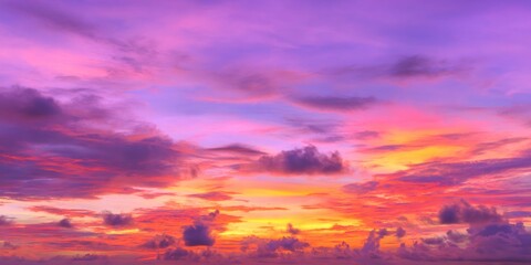 Fototapeta premium Vibrant tropical sunset with dramatic clouds painting the sky purple, pink, orange, and yellow hues