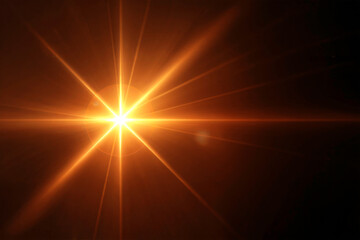Golden Starburst Light Flare on Dark Background with Radiant Energy Beams