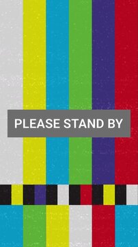 Please Stand By Message Television Screen Displaying Color Bars.  Television Test Card Transmission No Signal Broadcast With Glitch Distortion Noise Static Bad Interference Effects - Vertical Video. 