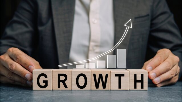Wooden cubes spelling GROWTH, with rising bar graph and arrow-up hologram floating above, professional business development concept. - Powered by Adobe