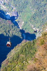 Zhangjiajie, hunan, China. 11-09-2024. Cable car to Tianmen Mountain above the buildings of Zhangjiajie City in Hunan, China.