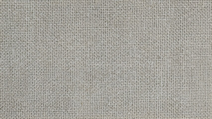 Fototapeta premium A close-up, high-angle shot of a light gray woven fabric with a visible texture.