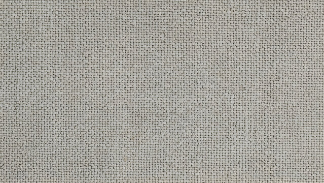 A close-up, high-angle shot of a light gray woven fabric with a visible texture.