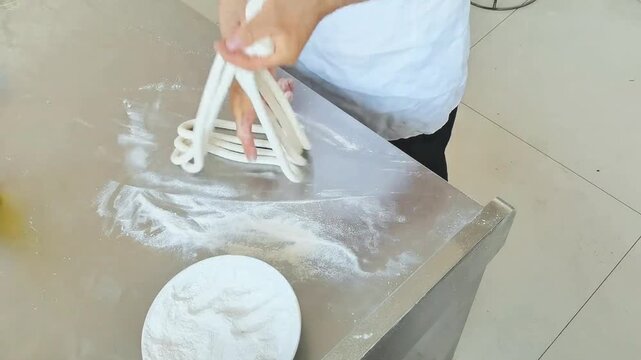 The chef is making Chinese hand-pulled noodles