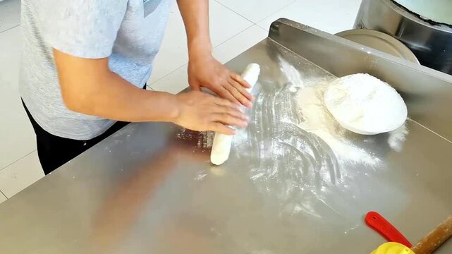 The chef is making Chinese hand-pulled noodles	