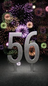 Silver number 56 with fireworks in the background. Festive scene for birthday or anniversary party