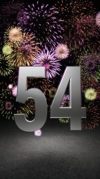 Silver number 54 with fireworks in the background. Festive scene for birthday or anniversary party