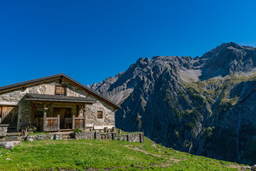 Fototapeta premium Serene Mountain Chalet Amidst Austrias Stunning Gadental Valley Alpine Scenery
