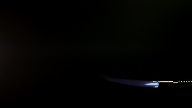 Blue Blowtorch Flame Jet in Smoke 