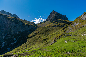 Fototapeta premium Majestic Mutterwangsjoch Summit Reveals Stunning Alpine Panorama in Austrias Great Walser Valley